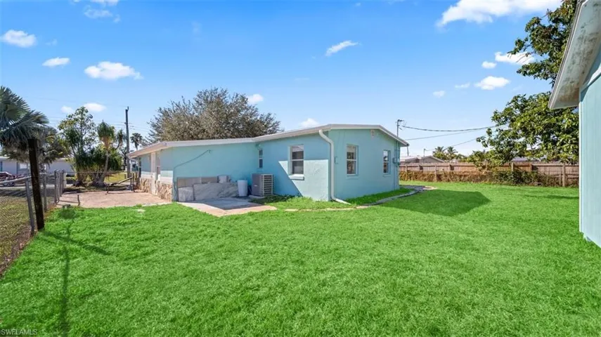 Back of house with a fenced backyard, stucco siding, and a patio