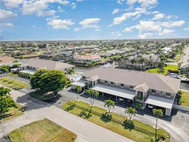 Aerial view of residential area featuring a large body of water