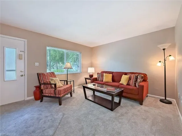 Living room featuring carpet flooring