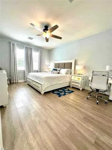 Bedroom featuring wood finished floors and ceiling fan