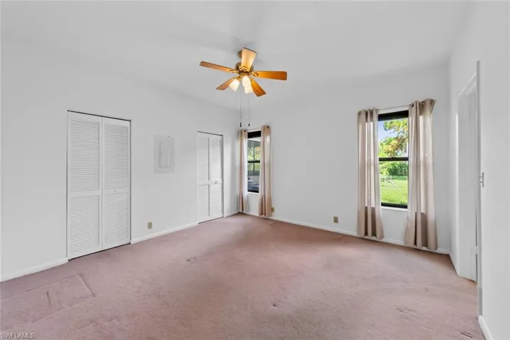Carpeted 2nd bedroom room featuring ceiling fan