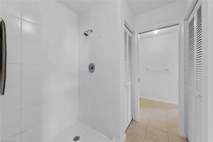 Bathroom featuring a tile shower