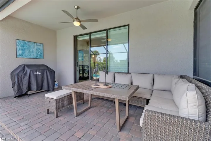 View of patio / terrace featuring outdoor seating, ceiling fan, and grilling area