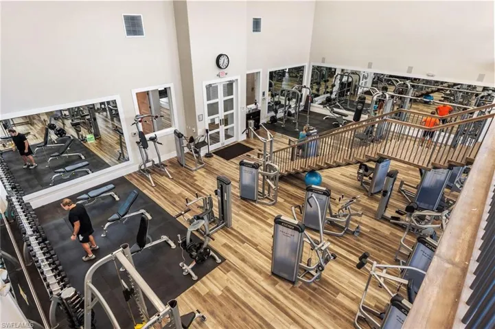 Exercise room featuring a high ceiling