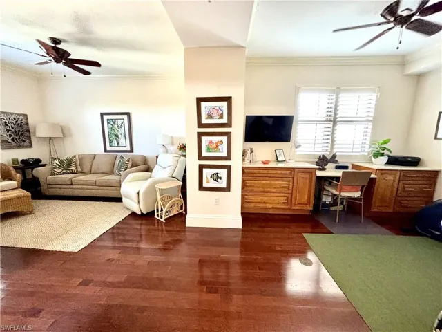 Guest On Suite featuring dark hardwood / wood-style floors and crown molding