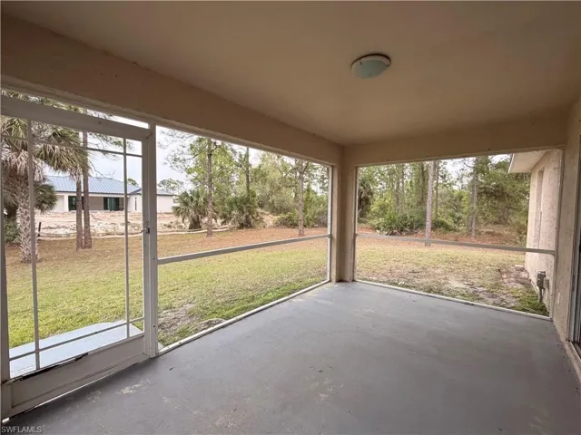 Unfurnished sunroom featuring plenty of natural light