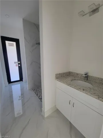 3rd Bathroom with exit to the backyard.