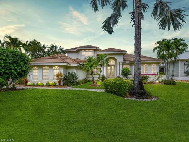 Mediterranean / spanish-style home with a front lawn