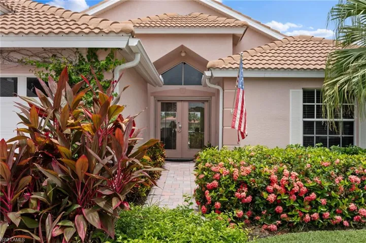Property entrance featuring french doors