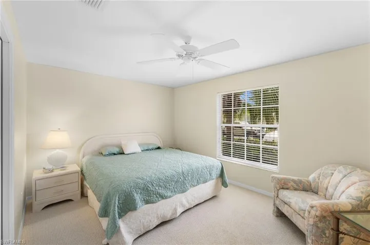 Bedroom featuring carpet and ceiling fan