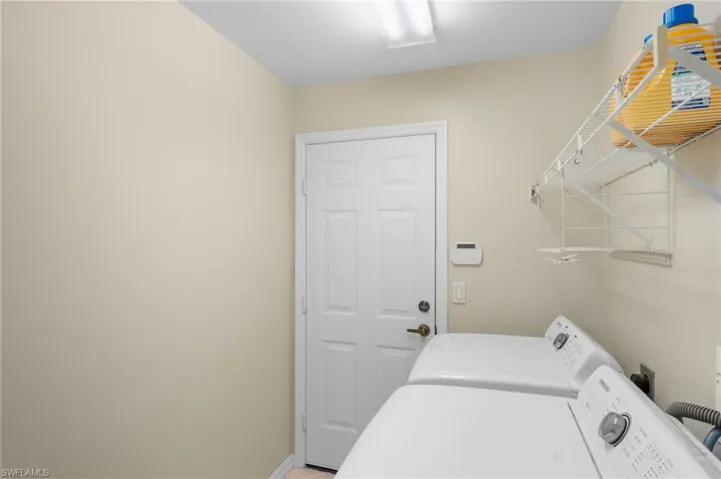 Laundry room with washing machine and dryer