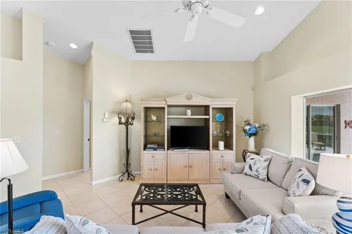 Tiled living room with ceiling fan