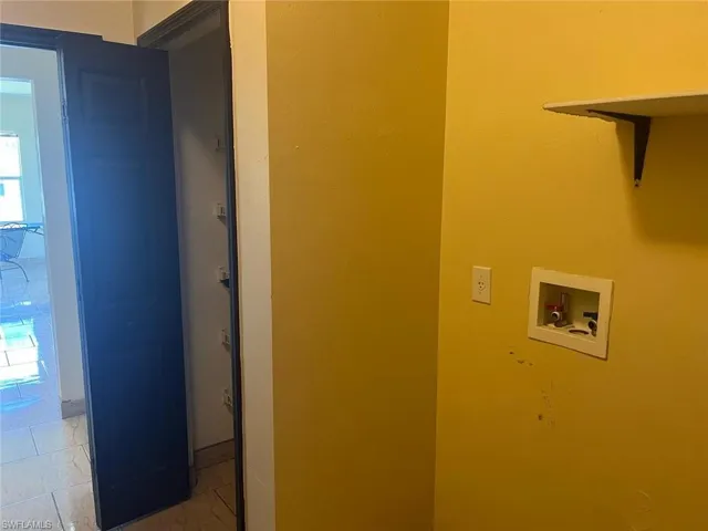 Washroom featuring washer hookup and healthy amount of natural light