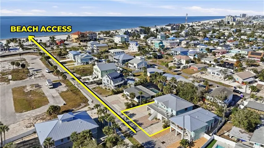 Aerial view of property and surrounding area with a nearby body of water - Virtually Edited Image