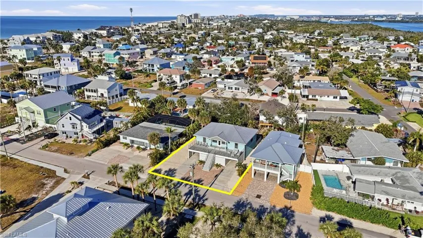 Aerial view of residential area with a large body of water