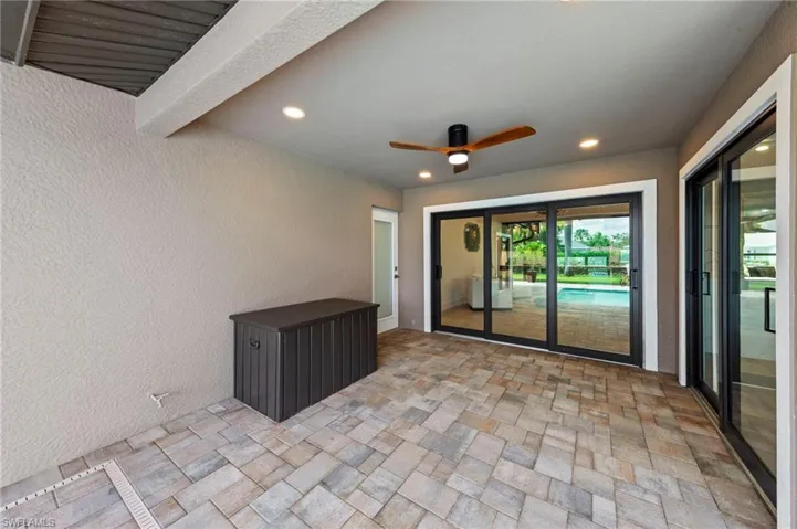 View of patio featuring ceiling fan