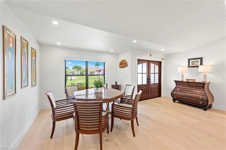 Dining space with recessed lighting, light wood-style flooring, and french doors