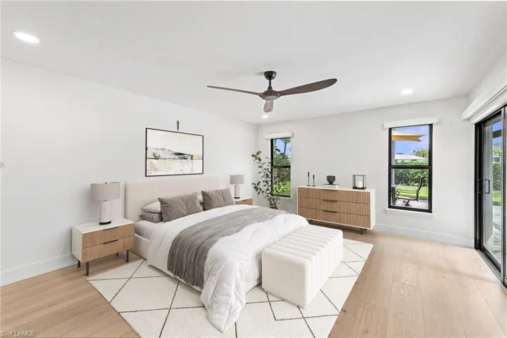 Bedroom with access to outside, recessed lighting, ceiling fan, and light wood-style floors