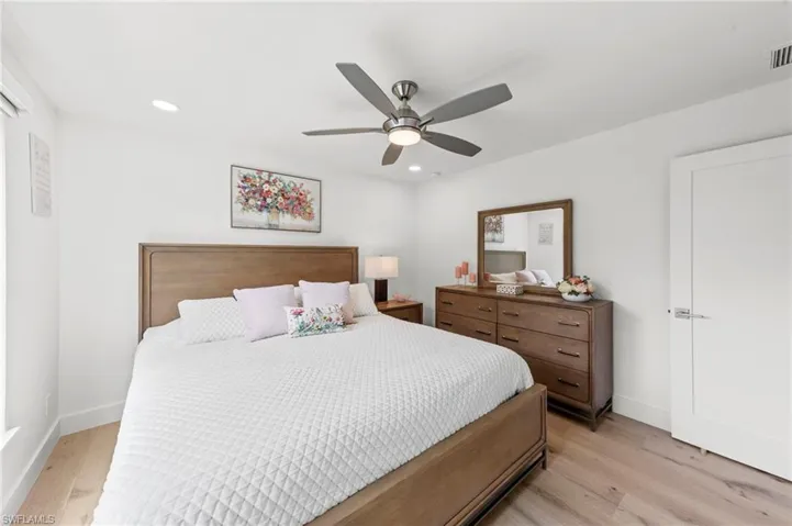 Bedroom featuring light wood-type flooring, recessed lighting, and ceiling fan