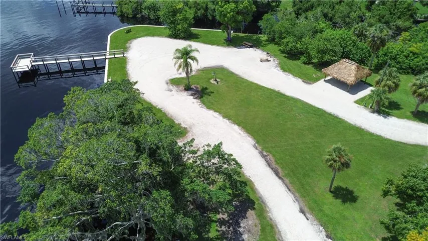 Private pier and park with tiki hut