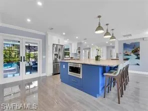 Fun colors and French doors to pool area