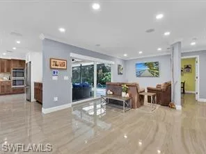 TV room with sliders to screened patio