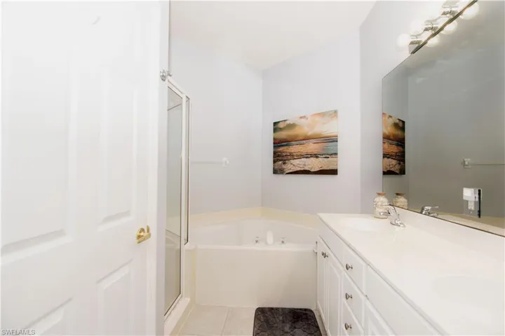 Unwind after a long day in the spa-like bathroom with soaking tub.