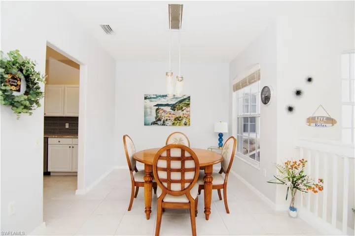 Large dining room adjacent to the kitchen. for enjoyable family dinners.