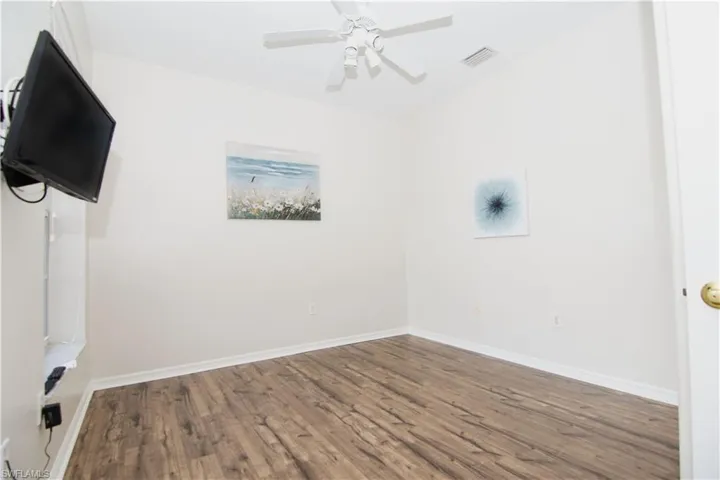 Bedroom/Den/Office features luxury vinyl plank flooring and a double closet.