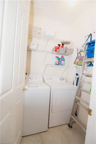 In unit laundry with washer and dryer.