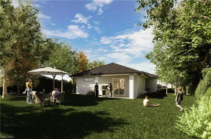 Rear view of property featuring stucco siding, cooling unit, and a yard
