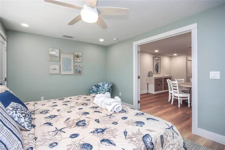 Bedroom featuring wood finished floors, recessed lighting, and a ceiling fan