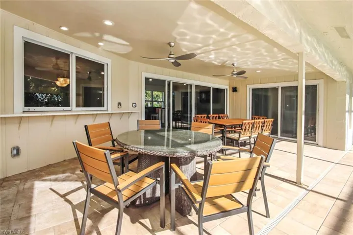 View of patio / terrace with outdoor dining area and a ceiling fan
