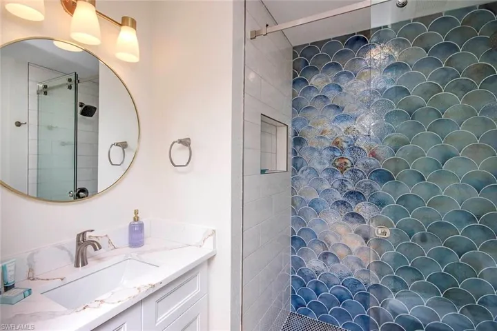 Full bath with walk in shower and vanity