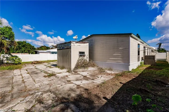 View of side of property featuring a patio area