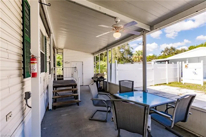 View of patio / terrace with area for grilling and ceiling fan