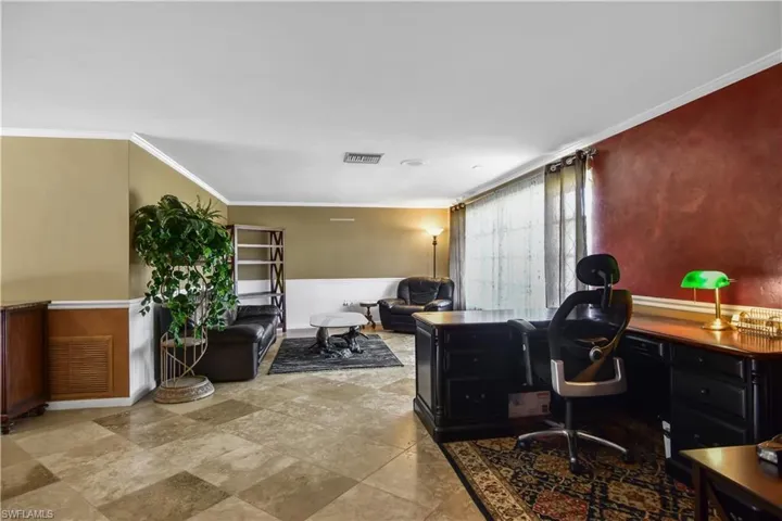 Formal living room currently set up as a home office.