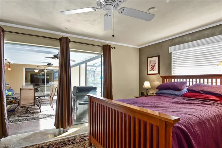 Primary bedroom with sliders leading to the lanai.