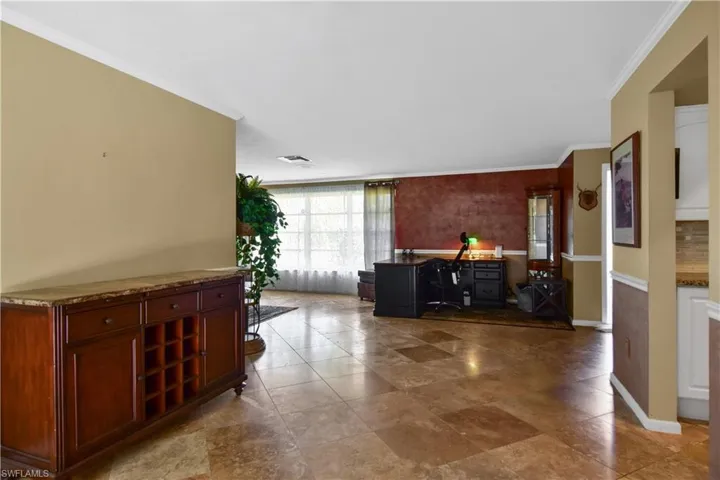 View of Living room from the lanai featuring ornamental molding