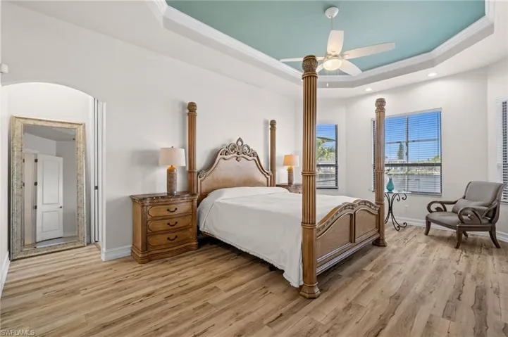 Primary Bedroom with tray ceilings and 2 large walk-in closets