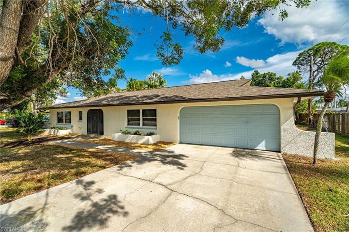 8518 EXETER ST in FT MYERS VILLAS.  New Exterior paint!