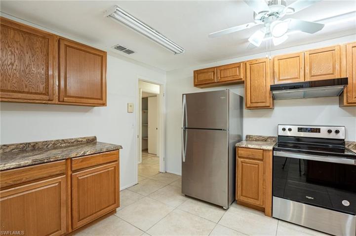 Plenty of wood cabinets and counter tops!