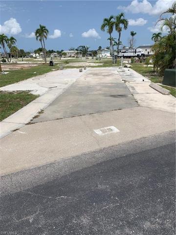 LARGE CORNER LOT ACROSS FROM THE POOL