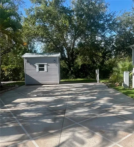 View of patio / terrace featuring an outbuilding