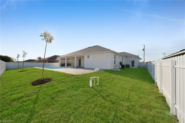 View of yard with a patio area, a fenced backyard, and a fenced in pool