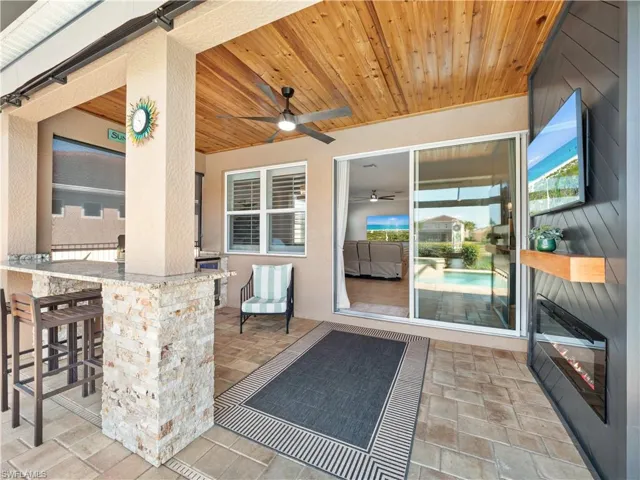 View of patio featuring a ceiling fan