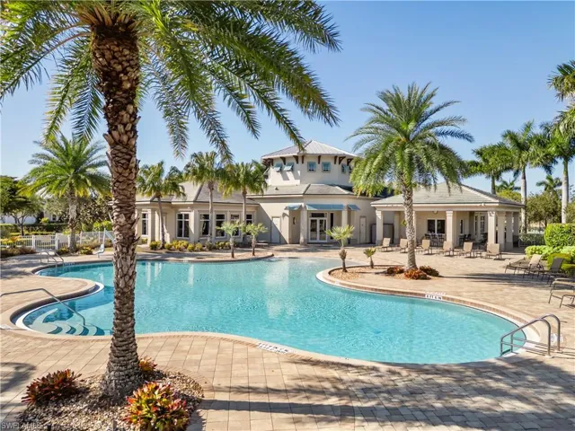 Community pool with a patio