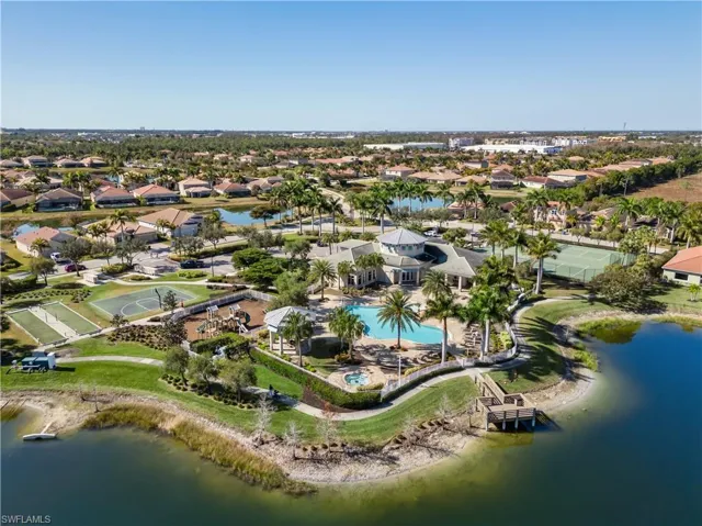 View of property location featuring a nearby body of water and nearby suburban area