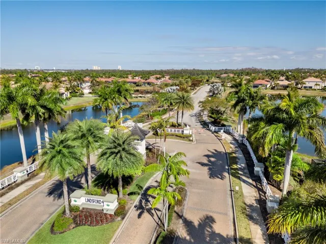 Aerial perspective of suburban area with a nearby body of water