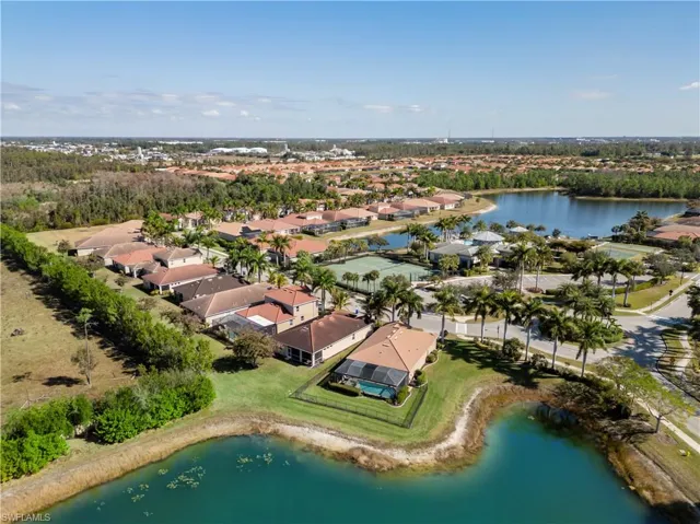 Aerial view of residential area featuring a large body of water